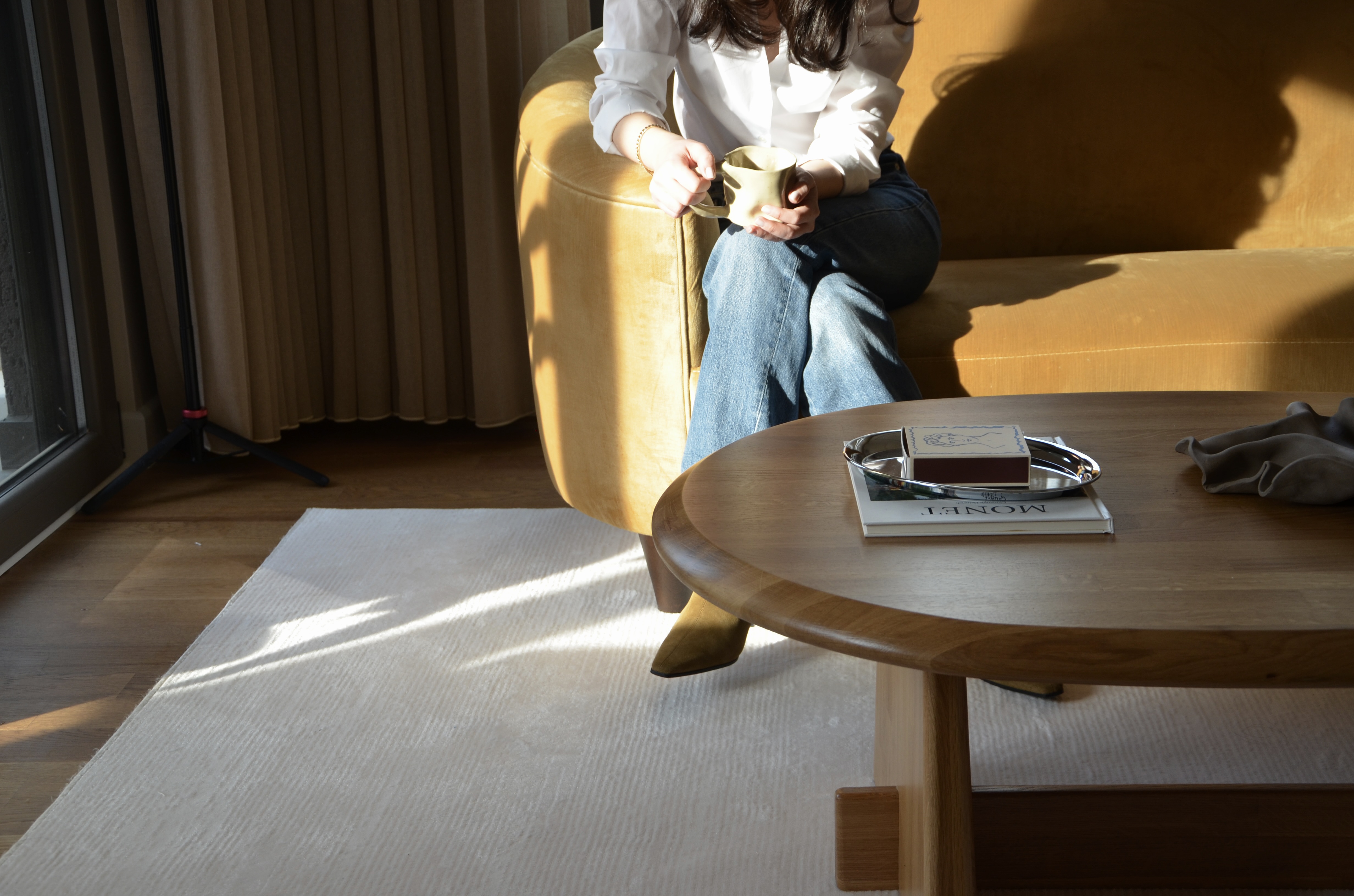 Person sitting in yellow chair